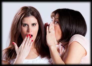 Two women telling secrets